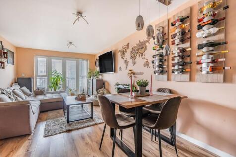 Open plan living space with balcony