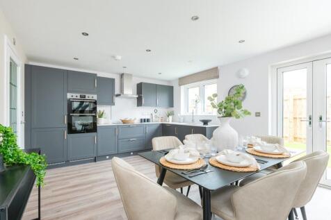A spacious kitchen and dining area with French doors to the rear garden