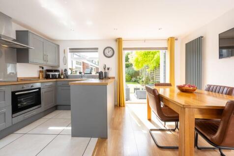 KITCHEN, DINING AREA onto REAR GARDEN...