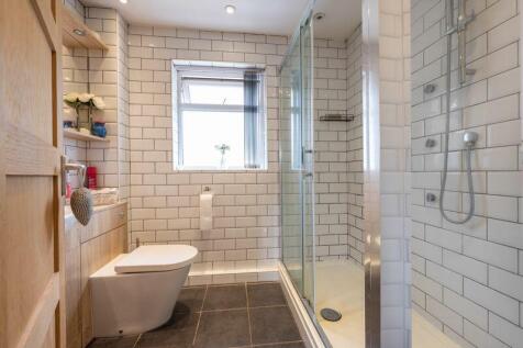 RE-FITTED SHOWER ROOM (REAR)
