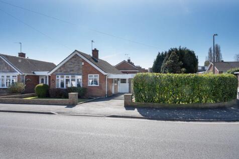 FRONT with SIDE GARDEN AREA