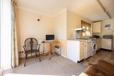 REAR LOUNGE AREA into KITCHEN