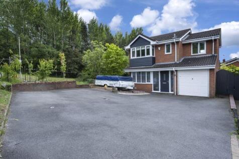 FRONT OF PROPERTY with DRIVEWAY