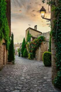 View of a flowered street in the medieval village 