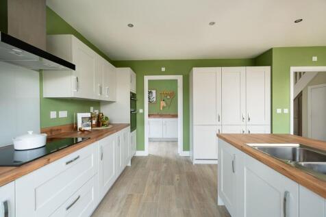 There's a useful utility room off the kitchen, with access to the driveway