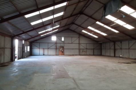 The interior of a warehouse unit, facing the back.