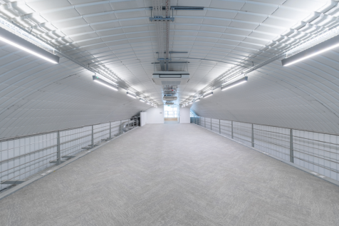 The mezzanine level of an arch with white lining.