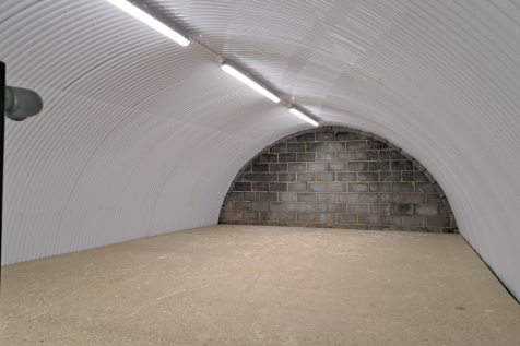 The mezzanine level of an arch with white lining.