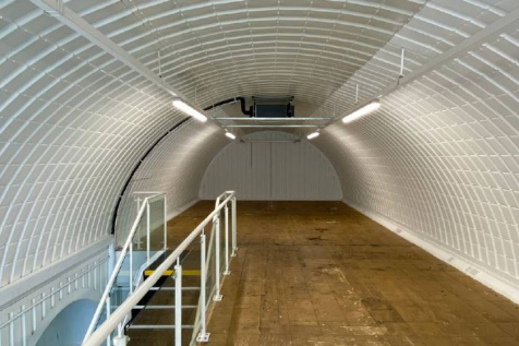 The mezzanine level of an arch with white lining.