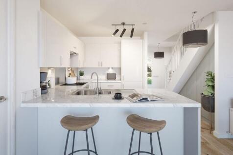 The handy breakfast bar for those informal meals helps to define your spaces