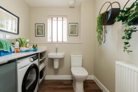 A handy downstairs utility/cloakroom with extra storage space