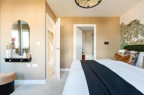 The main bedroom spans the full width of the house
