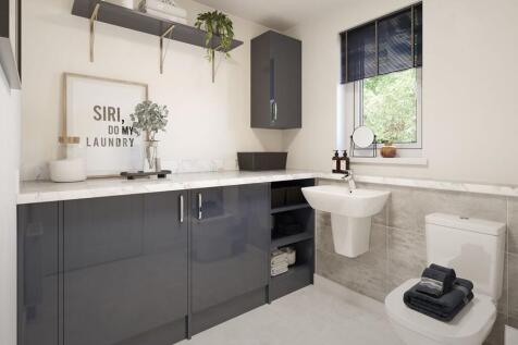 The guest cloakroom doubles as a utility keeping laundry out of the living space