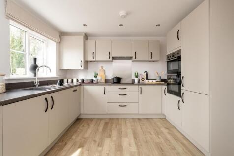 Modern 3-sided kitchen with ample storage space