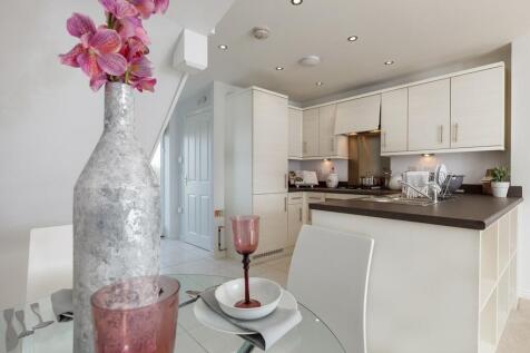 An open plan kitchen dining area is designed for sociable living