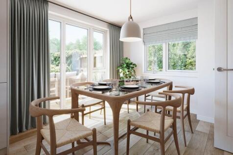 The dining area features double doors out to the garden