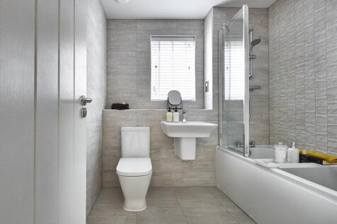 Stylish bathroom with shower over bath