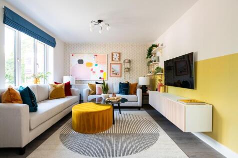 The living room provides a relaxing space at the front of the home for the family