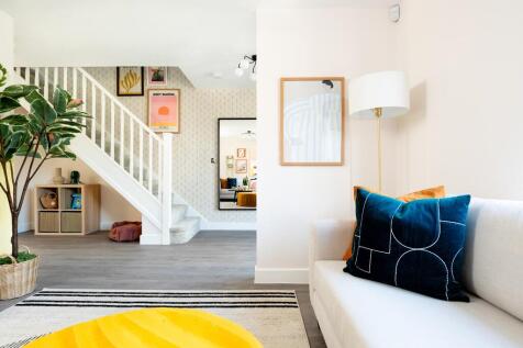The large hallway leads into the open layout of the ground floor