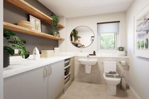 A handy utility/WC sits off the hallway