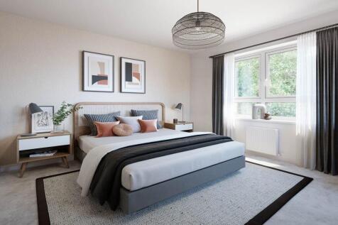 The spacious main bedroom features plenty of natural light