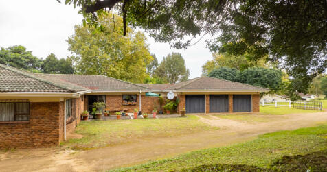 Main house with triple garage and ample parking space