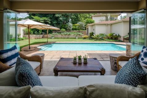 Enclosed verandah with seamless glass stack back doors