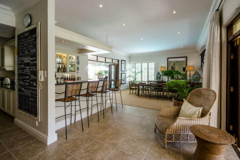 Elegant bar area leading to undercover verandah