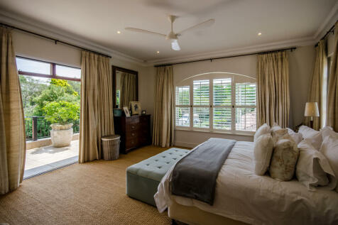 Main bedroom leading out to balcony