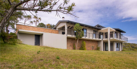 Back of house with storage area for the pool