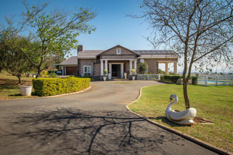Grand entrance through tar driveway