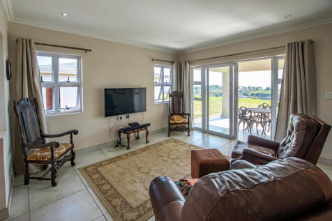 Spacious open plan living with doors opening out onto undercover veranda