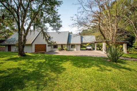 Entrance with carport and double garage