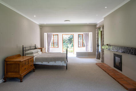 Large main ensuite with fireplace and separate seating area