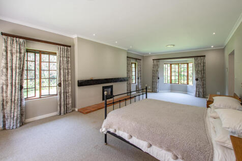 Main bedroom with wood burning fireplace