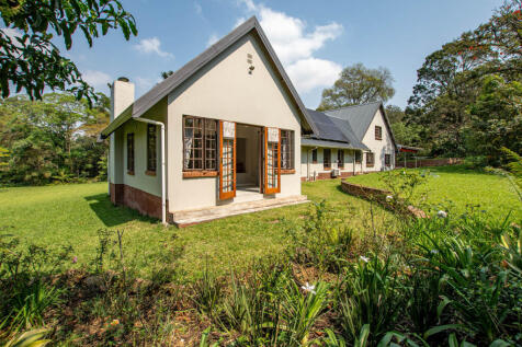 Double doors leading from main ensuite out onto the beautiful landscaped garden
