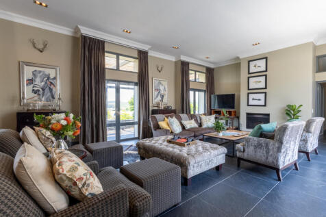 Relaxing living space with doors to front patio