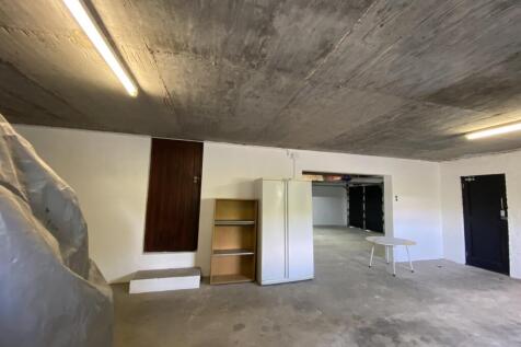 3 Garages in total with 2 strore rooms