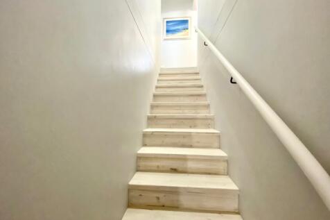 Solid stairs linking ground floor to 1st floor