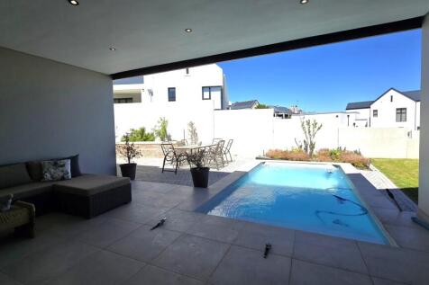 OUTSIDE PATIO AND SWIMMING POOL