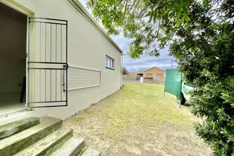 Door to seperate room with bathroom at back