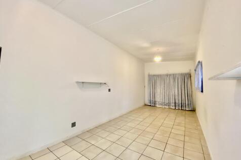 Ample space for double bed and couch with table