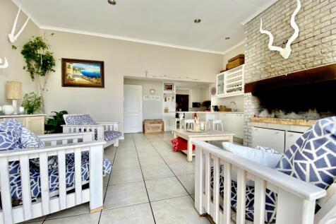 Wide fire hearth in open plan living area