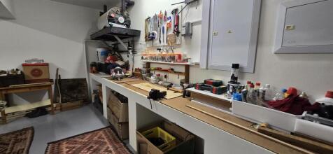 Garage for 4 cars, with loo, and extra storage cupboards