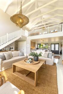 Pop upstairs to a sunny TV room