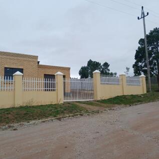 Gate entrance to carport