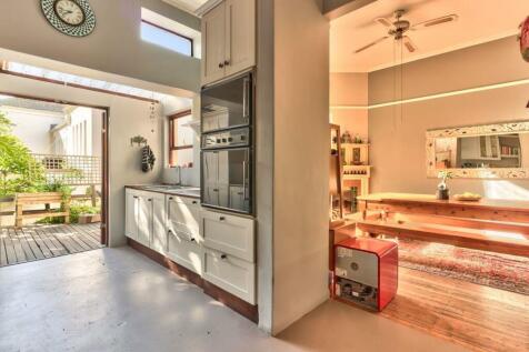 Kitchen opens onto deck and flows into dining room