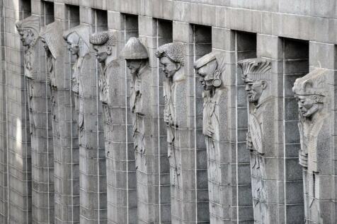 Figures of different tribal leaders carved into the building facade 