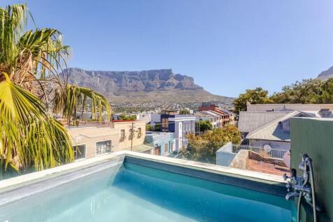 Private rooftop pool with panoramic Table Mountain, Lions Head and Devils Peak views