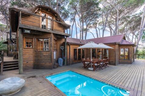 Front verandah and swimming pool and entrance to dining room and lounge beyond